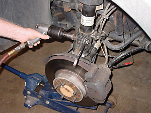 Figure 5 - removing the two nuts and bolts securing the lower strut mounting bracket to the spindle